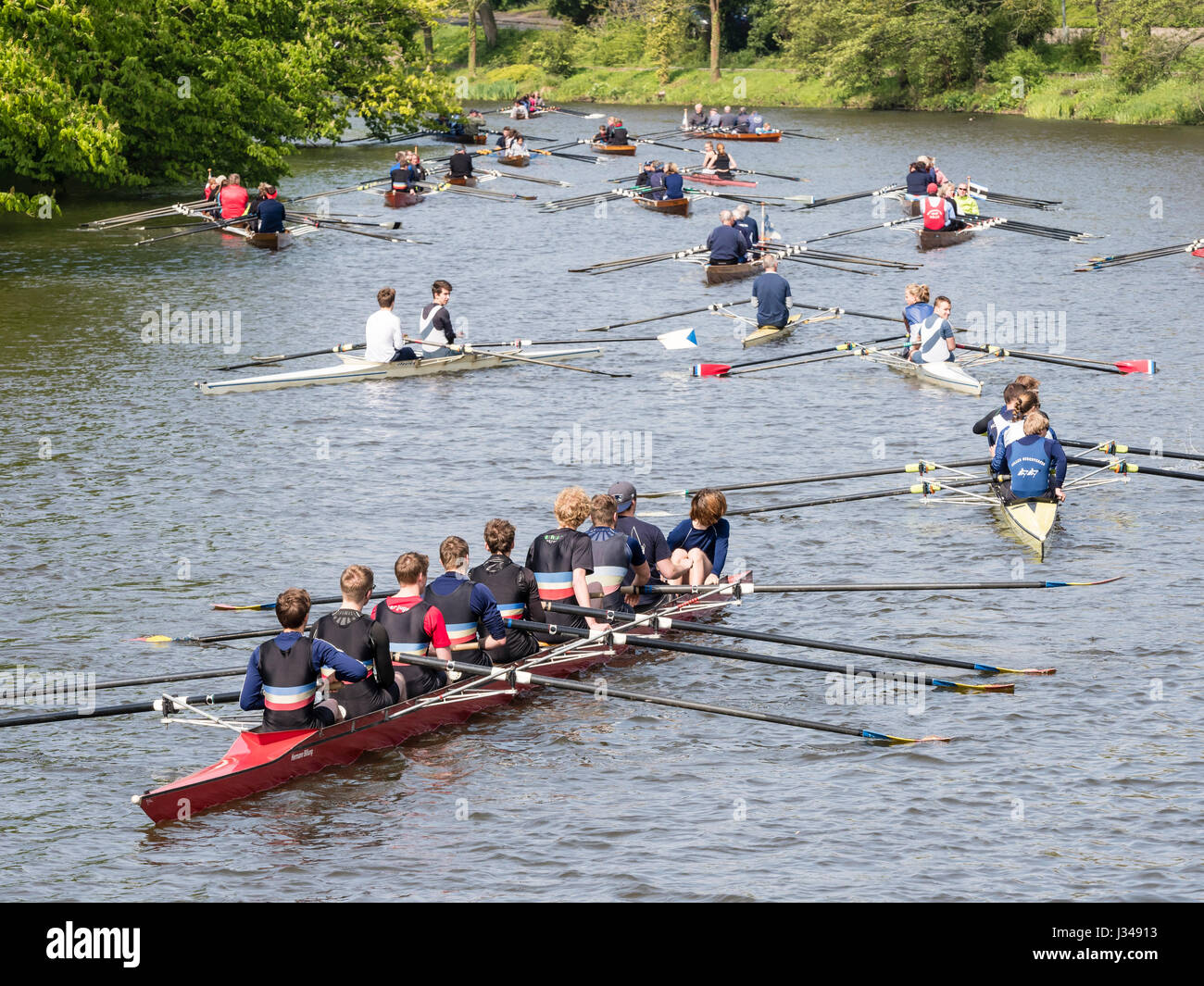 Rowing clubs celebrate the start of the rowing season, all kinds of boats  active, eight-man scull, rowing on river Aller, Celle, Germany Stock Photo