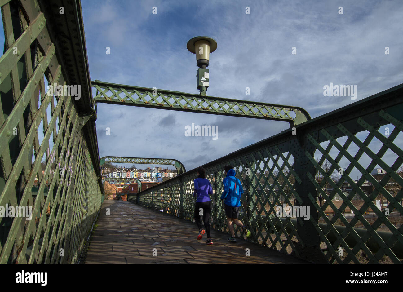 Spike Island bridge joggers Bristol Stock Photo