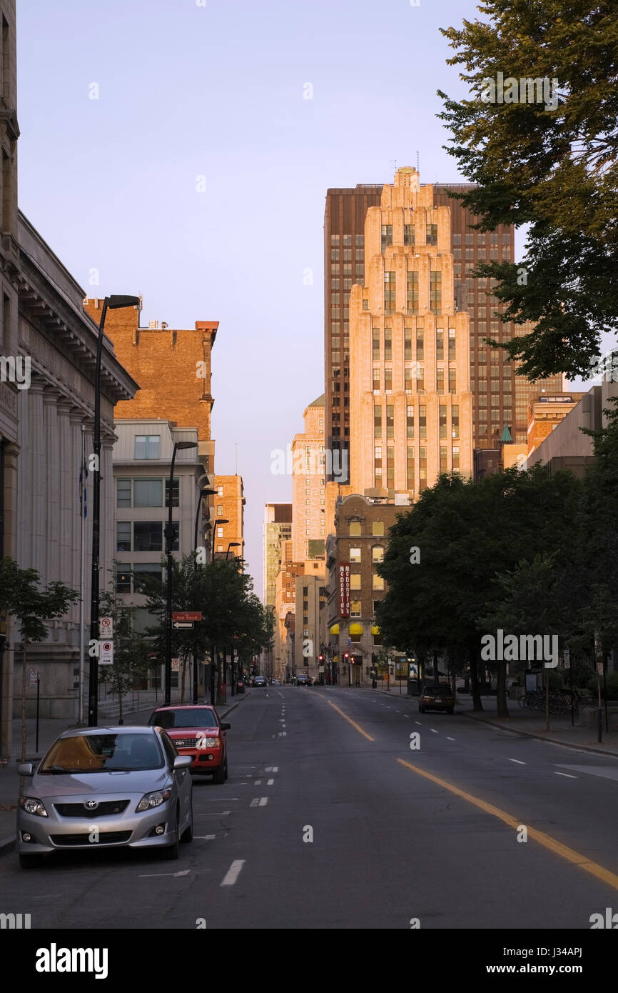 Notre-Dame Street without traffic looking Westward at Sunrise, Old Montreal, Quebec, Canada Stock Photo