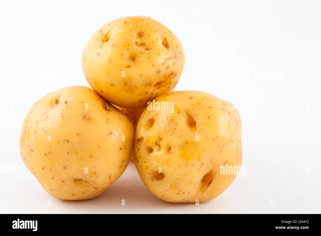 Yellow potato (Solanum phureja) isolated in white background Stock Photo