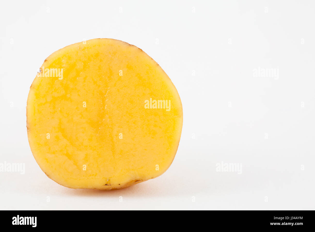 Yellow potato (Solanum phureja) isolated in white background Stock Photo