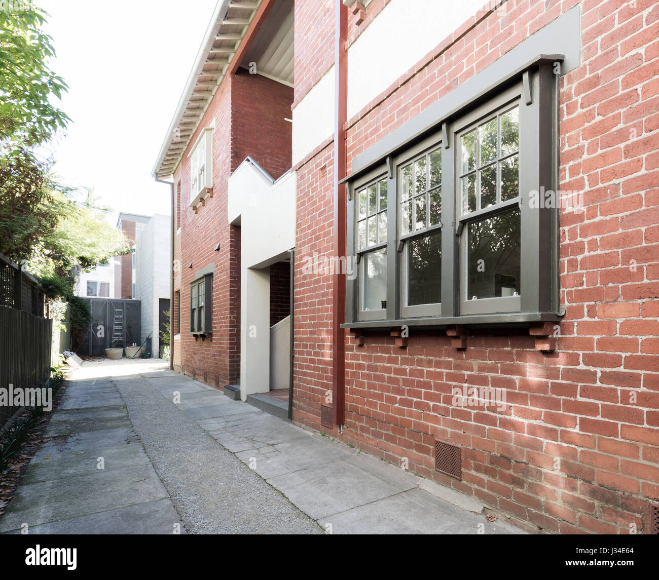 Older style red brick apartment building exterior in Melbourne Australia Stock Photo