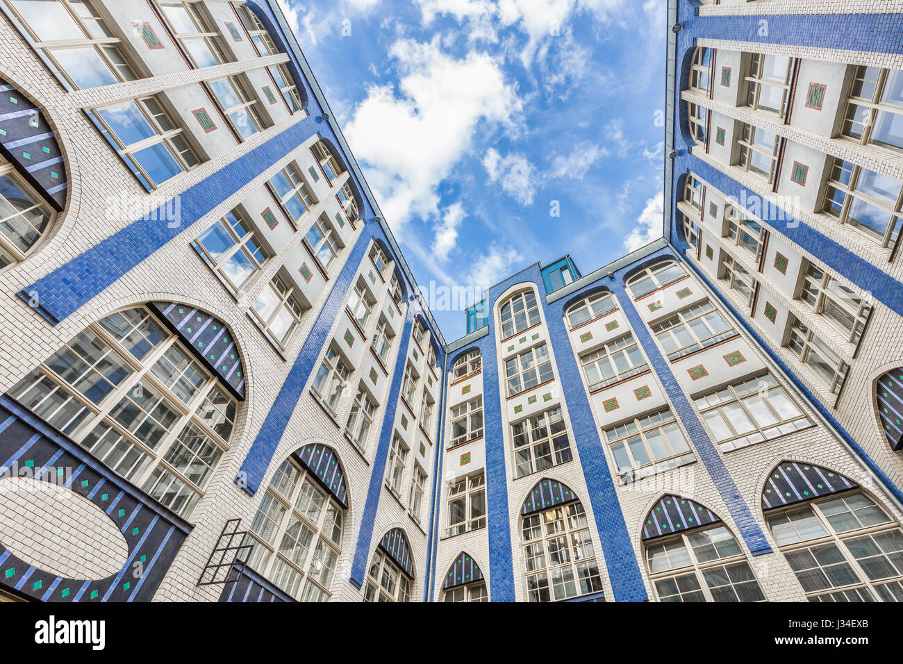 Bottom wide angle view of inner courtyard with beautiful facade at famous Hackesche Hofe building complex, district of Spandauer Vorstadt, Berlin Stock Photo