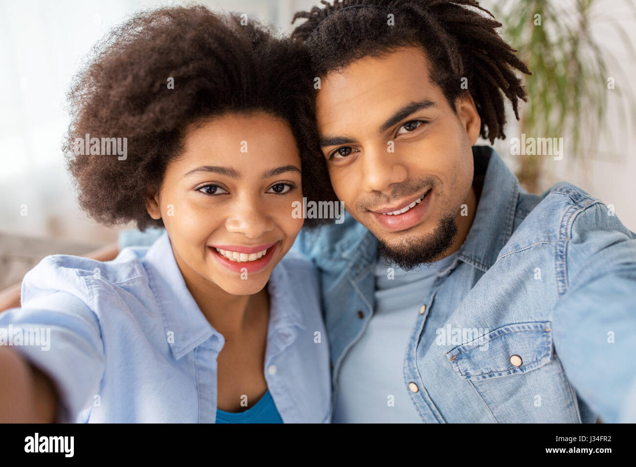 happy couple taking selfie at home Stock Photo - Alamy