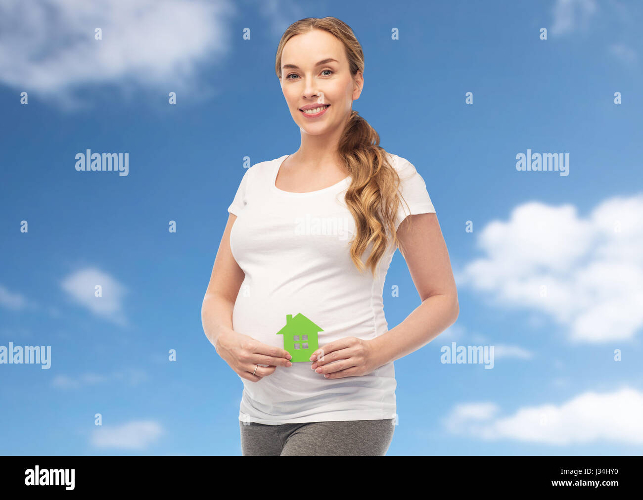 Pregnant young woman blue shirt hi-res stock photography and images - Alamy