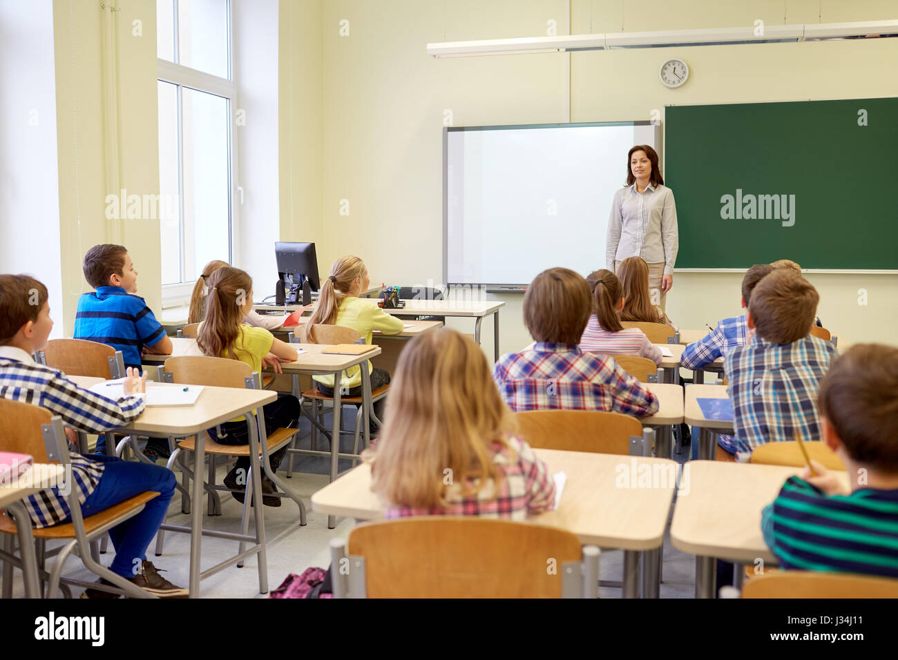 Group Of School Kids With Teacher In Classroom Stock Photo Alamy group-of-school-kids-with-teacher-in-classroom-stock-photo-alamy