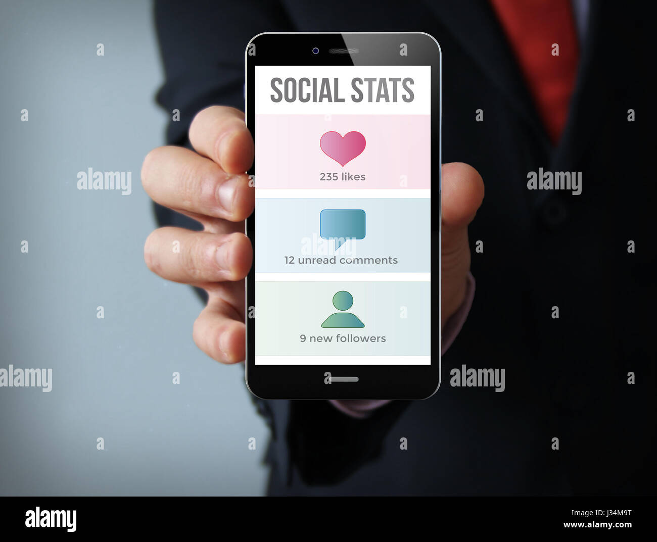 new technologies business concept: businessman hand holding a 3d generated touch phone with social stats on the screen. Screen graphics are made up. Stock Photo