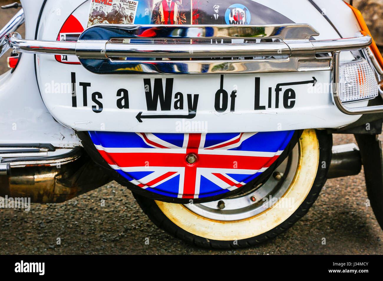 MOD decorated scooter with Union Jack and stickers promoting the Mod