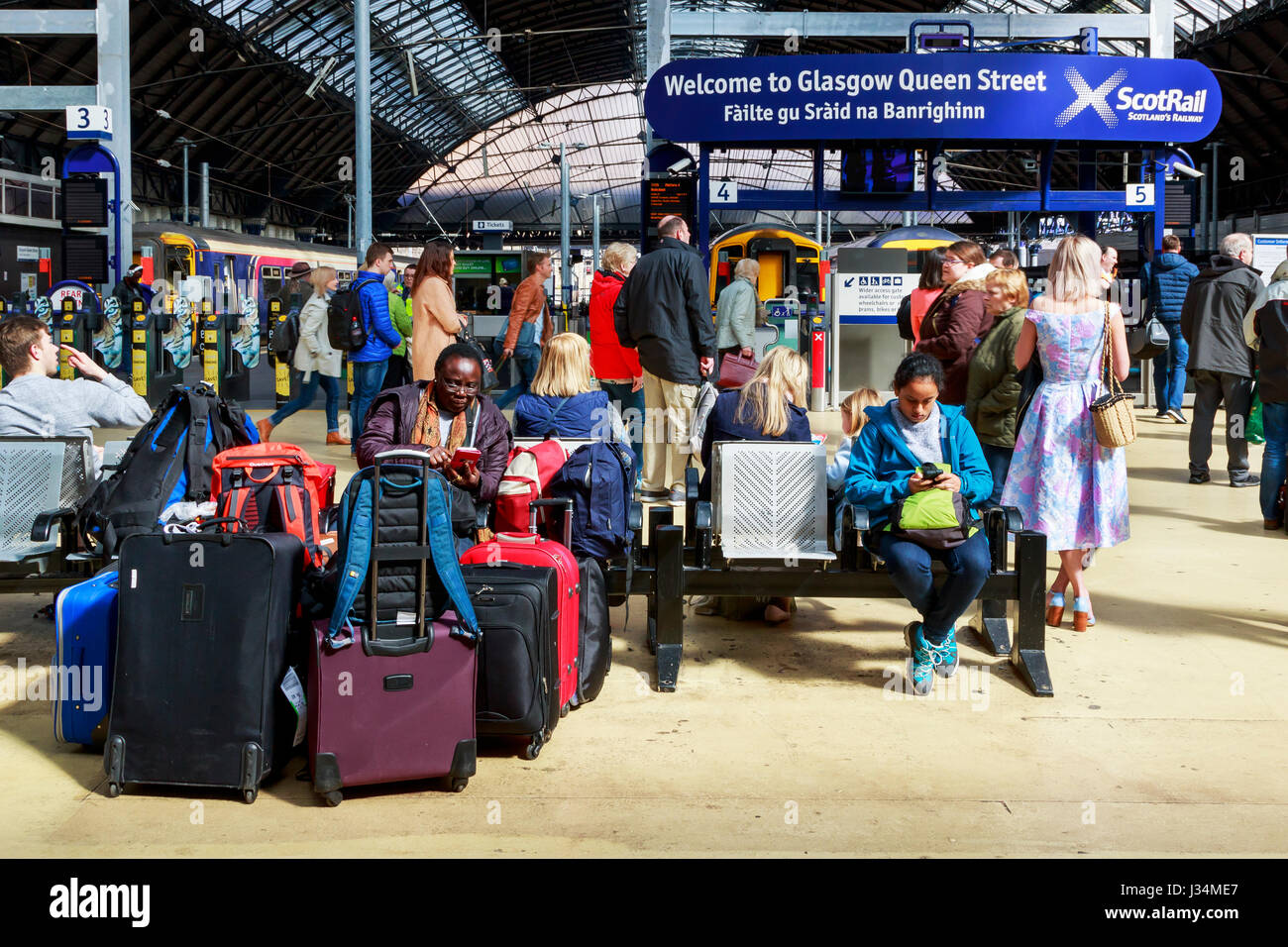 Passengers waiting at Queen Street railway station, Glasgow, Scotland, UK Stock Photo