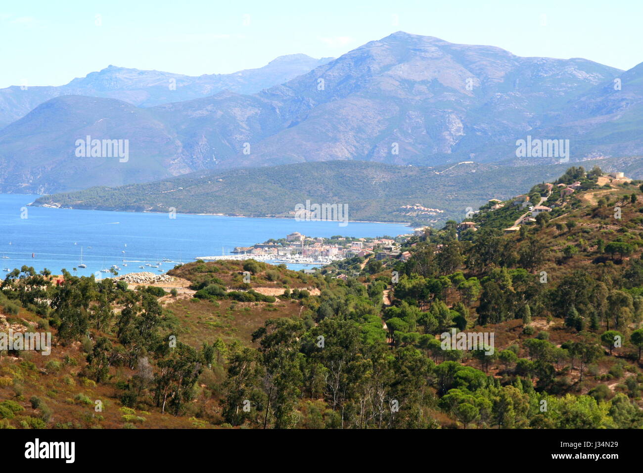 Panoramic view of the  small coastal town of St Florent in Northern Corsica, France, seen from nearby hilltop. Stock Photo