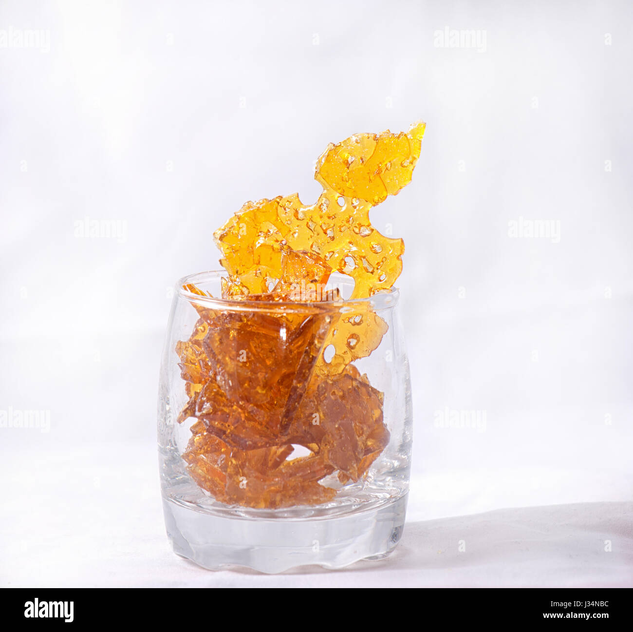 Shatter Abstract detail of cannabis oil concentrate aka shatter isolated ...