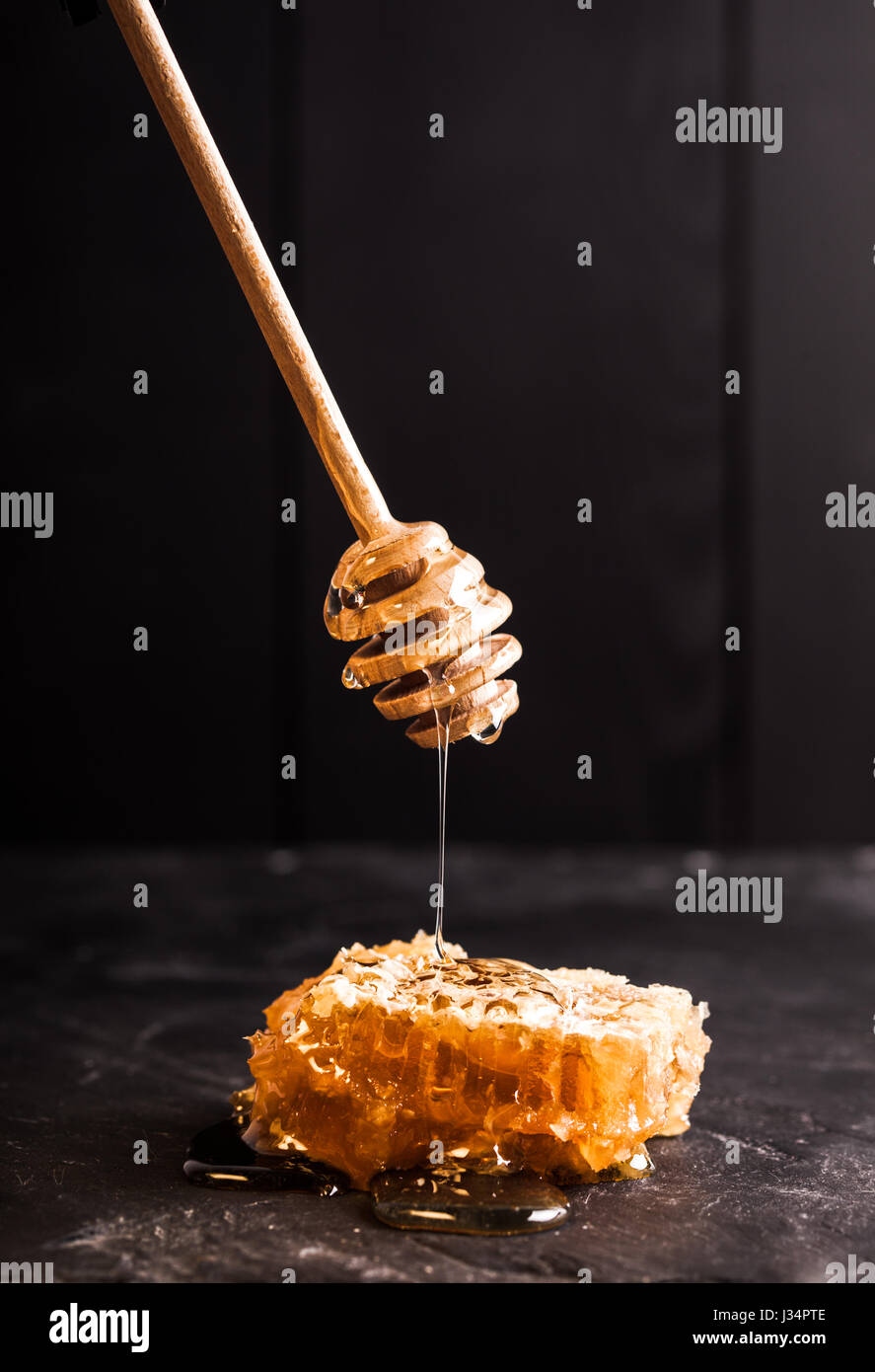 Honey drip and comb Stock Photo Alamy
