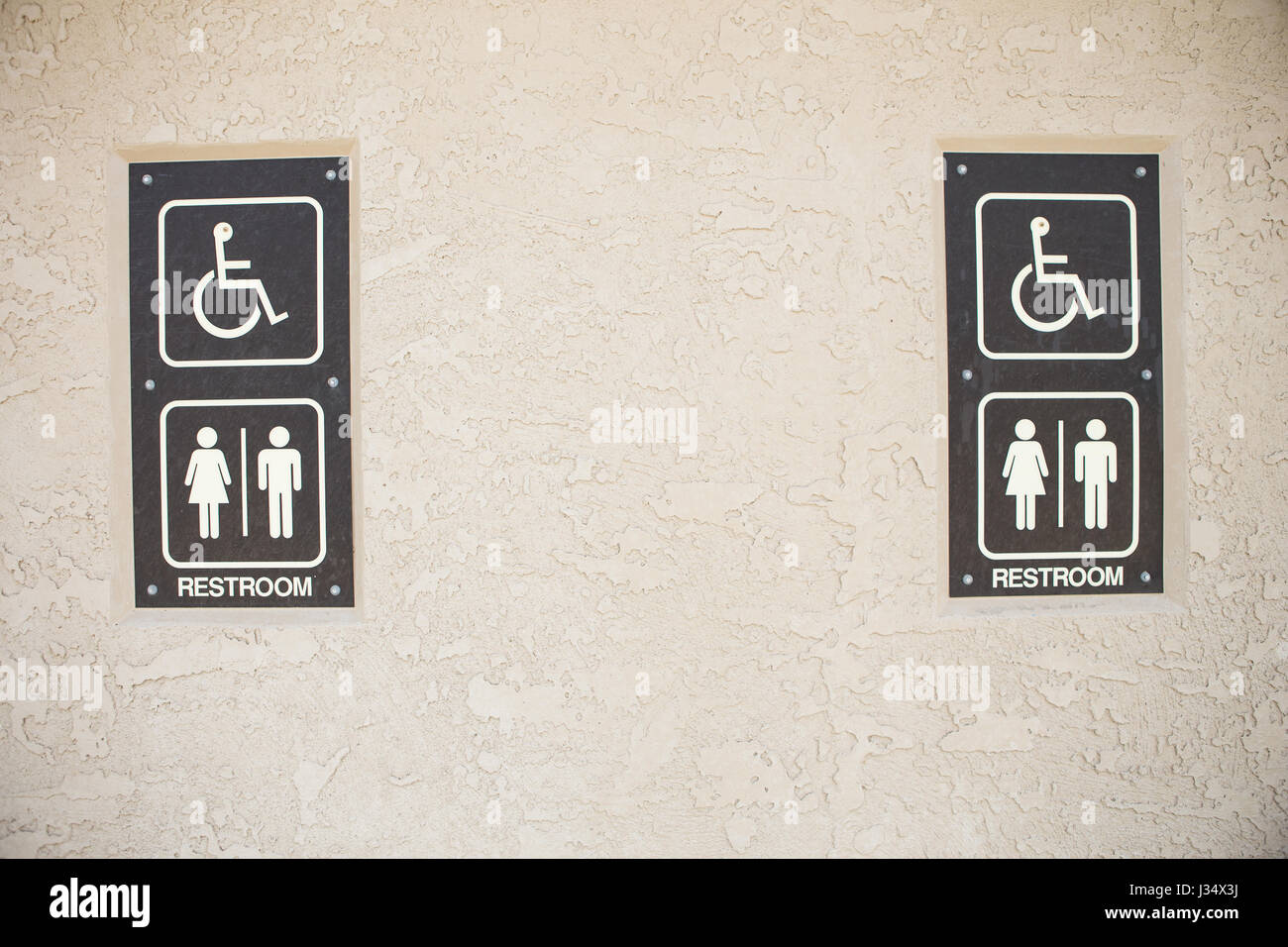 unisex public bathroom exterior sign Stock Photo - Alamy