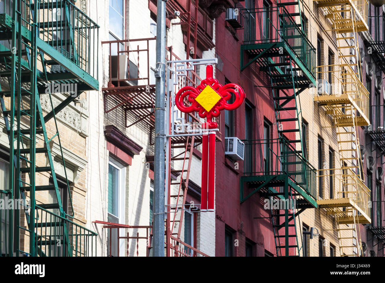 Red and yellow good luck icon in Chinatown, New York. The rounded sides say good fortune for all to share. Stock Photo