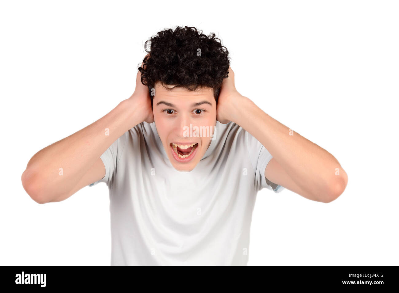 Portrait of a young amazed man. Isolated white background Stock Photo ...