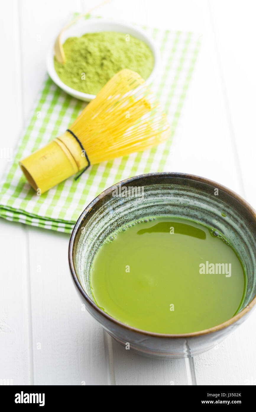 Green matcha tea in bowl. Stock Photo