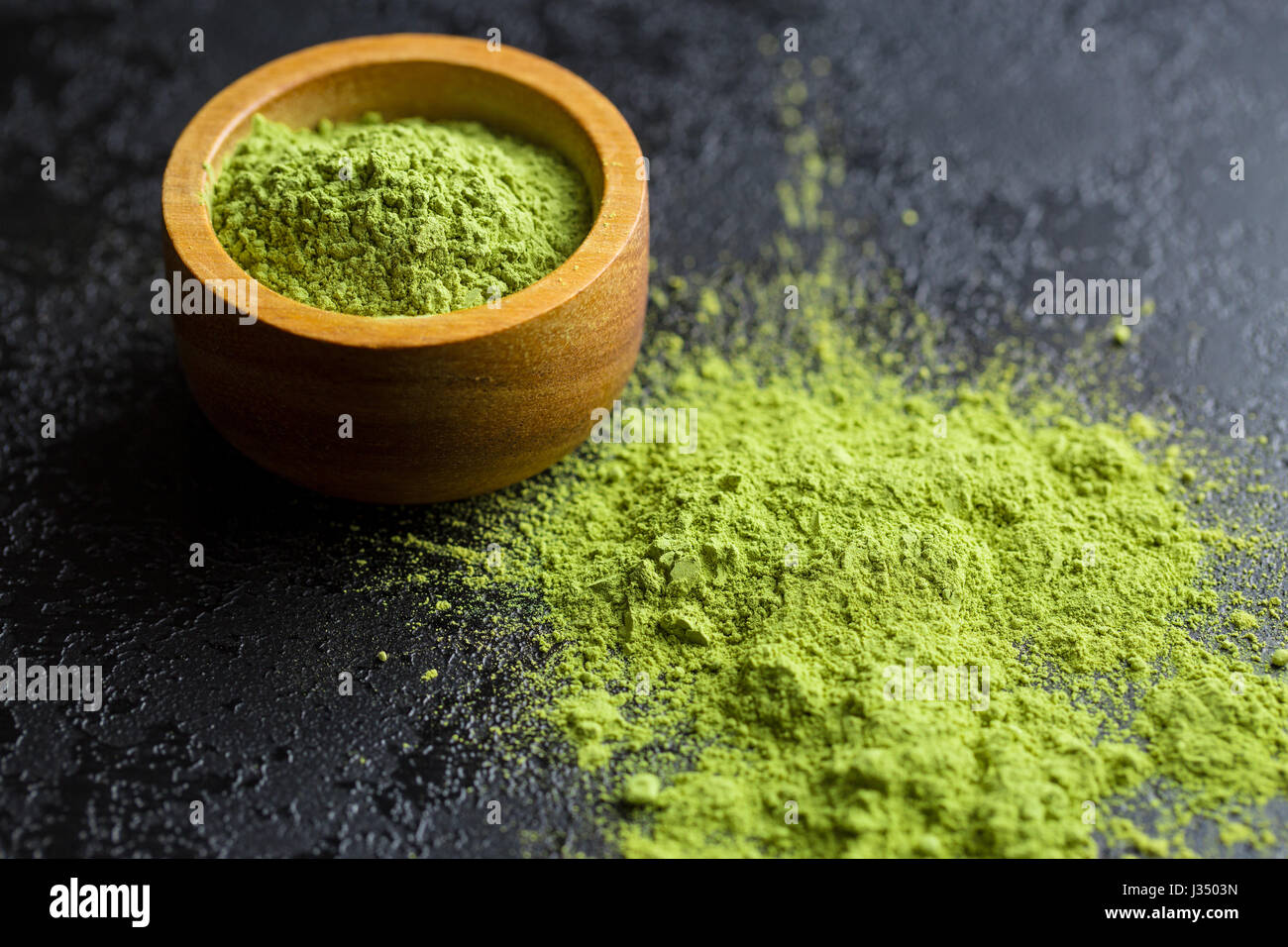 Green matcha tea powder in bowl Stock Photo - Alamy