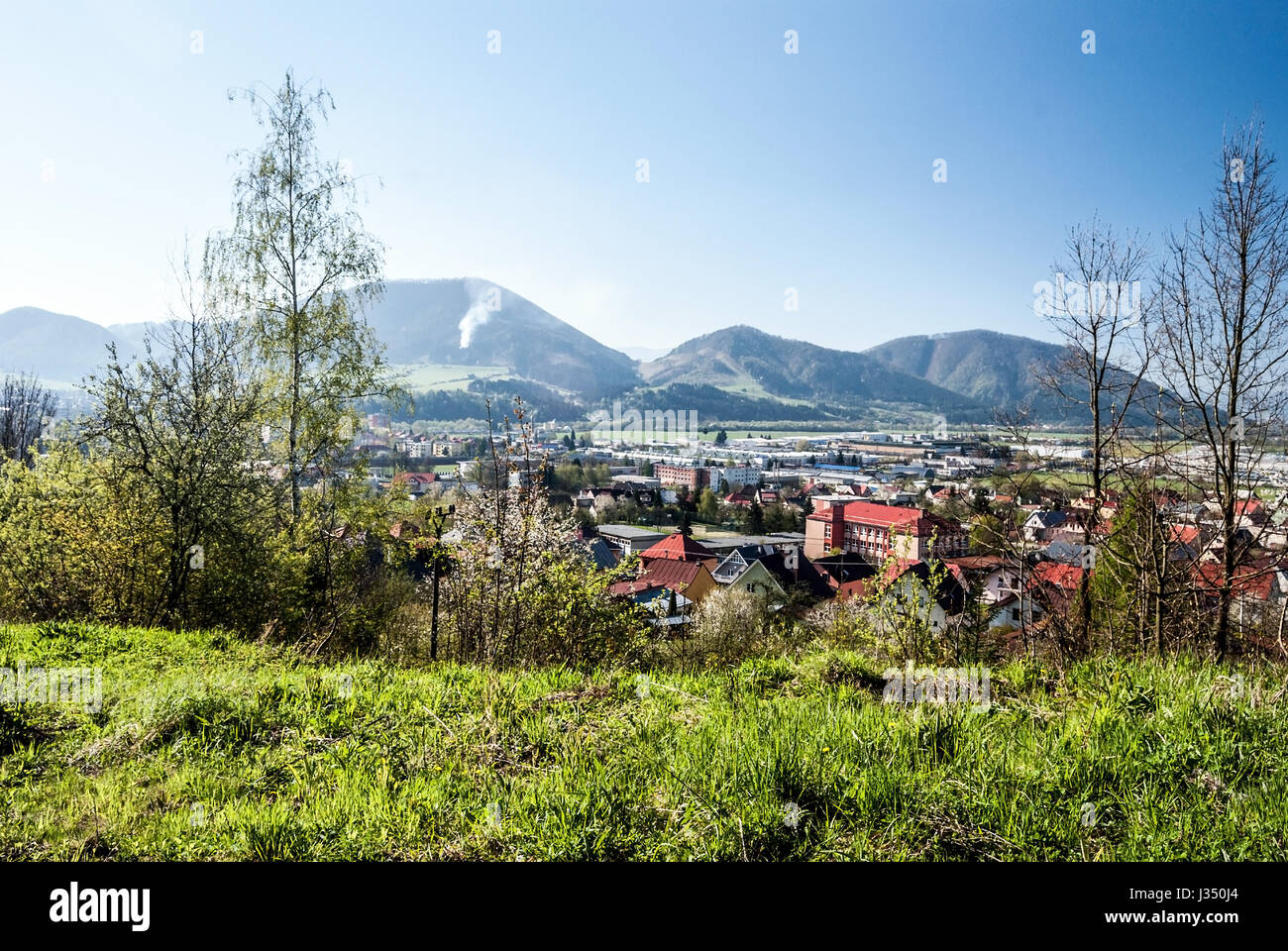 Kysucke Nove Mesto city with hills on the background and clear sky in Slovakia during nice spring day Stock Photo
