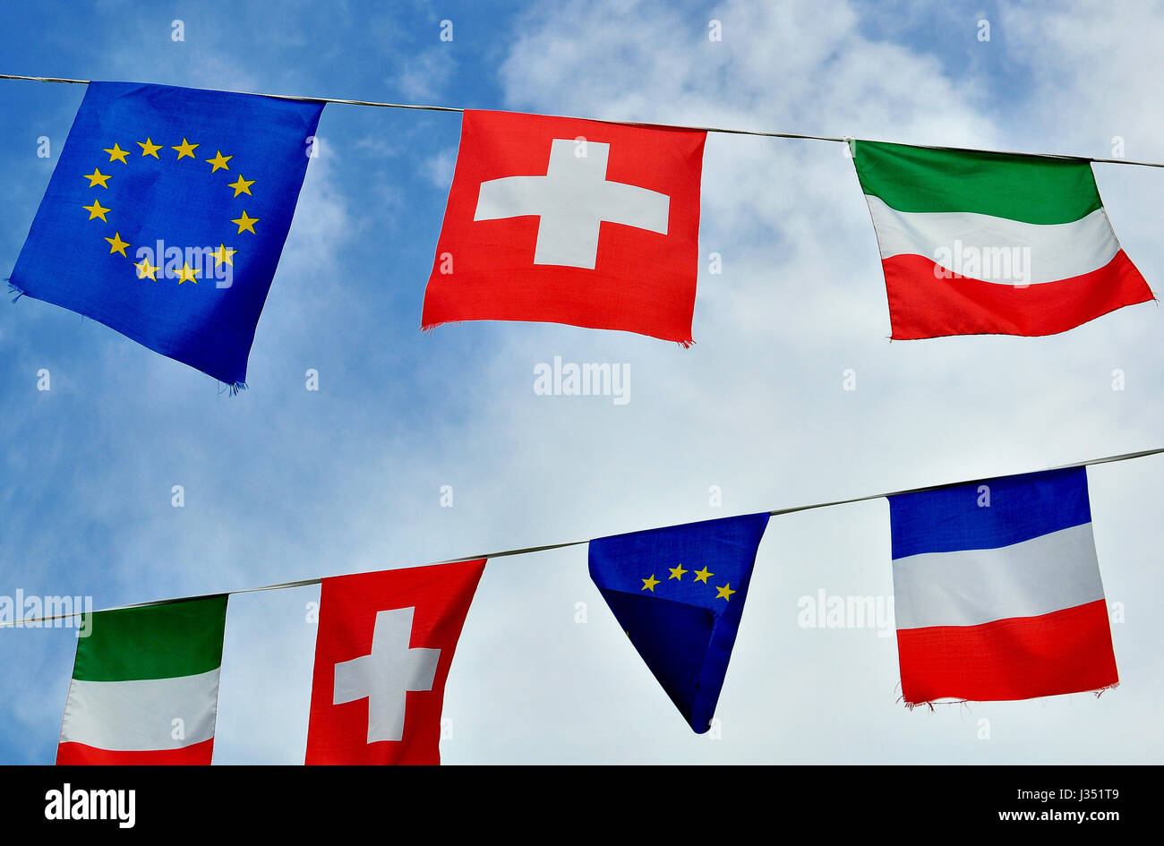 Flags of Italy, France, Switzerland and European Union in heaven Stock Photo