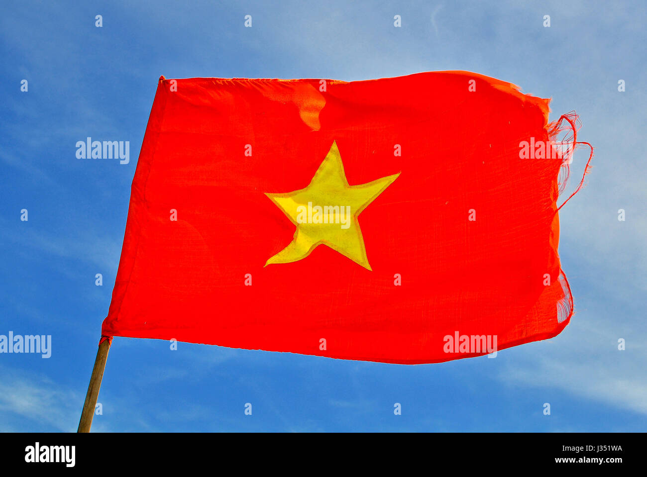 National flag of Vietnam with blue sky on background Stock Photo
