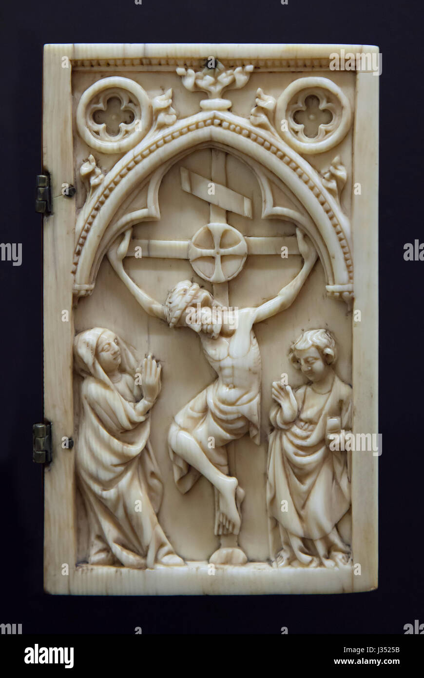 Crucifixion. Detail of the ivory diptych dated from ca. 1330 on display in the Musee des Beaux-Arts de Dijon (Museum of Fine Arts) in Dijon, Burgundy, France. Stock Photo