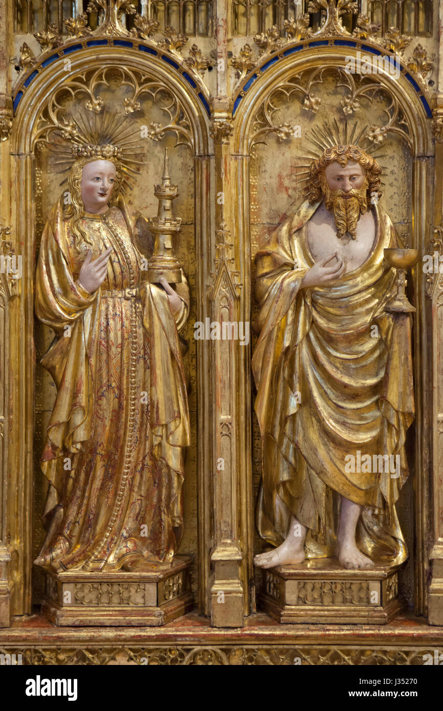 Saint Barbara (L) and Saint Judoc (R). Detail of the right wing of the Altarpiece of the Crucifixion from the Chartreuse de Champmol by Flemish Renaissance sculptor Jacques de Baerze (1390-1399) on display in the Musee des Beaux-Arts de Dijon (Museum of Fine Arts) in Dijon, Burgundy, France. Stock Photo