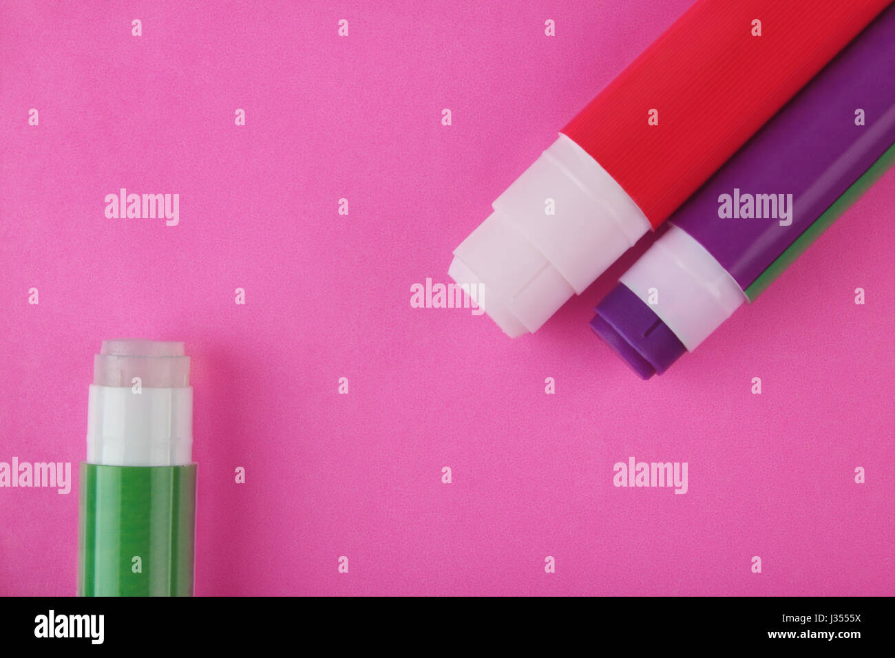 Glue Stick on Pink Background Stock Photo