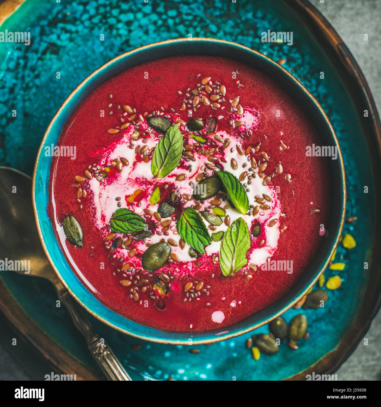 Beetroot vegetarian soup with mint, chia, flax and pumpkin seeds Stock Photo