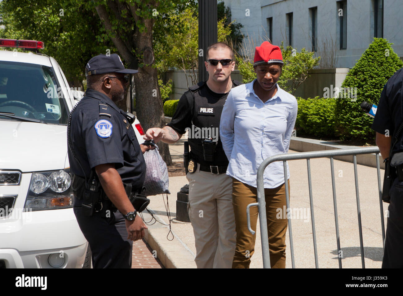 Woman handcuffed and arrested by US Capitol Police - Washington, DC USA Stock Photo
