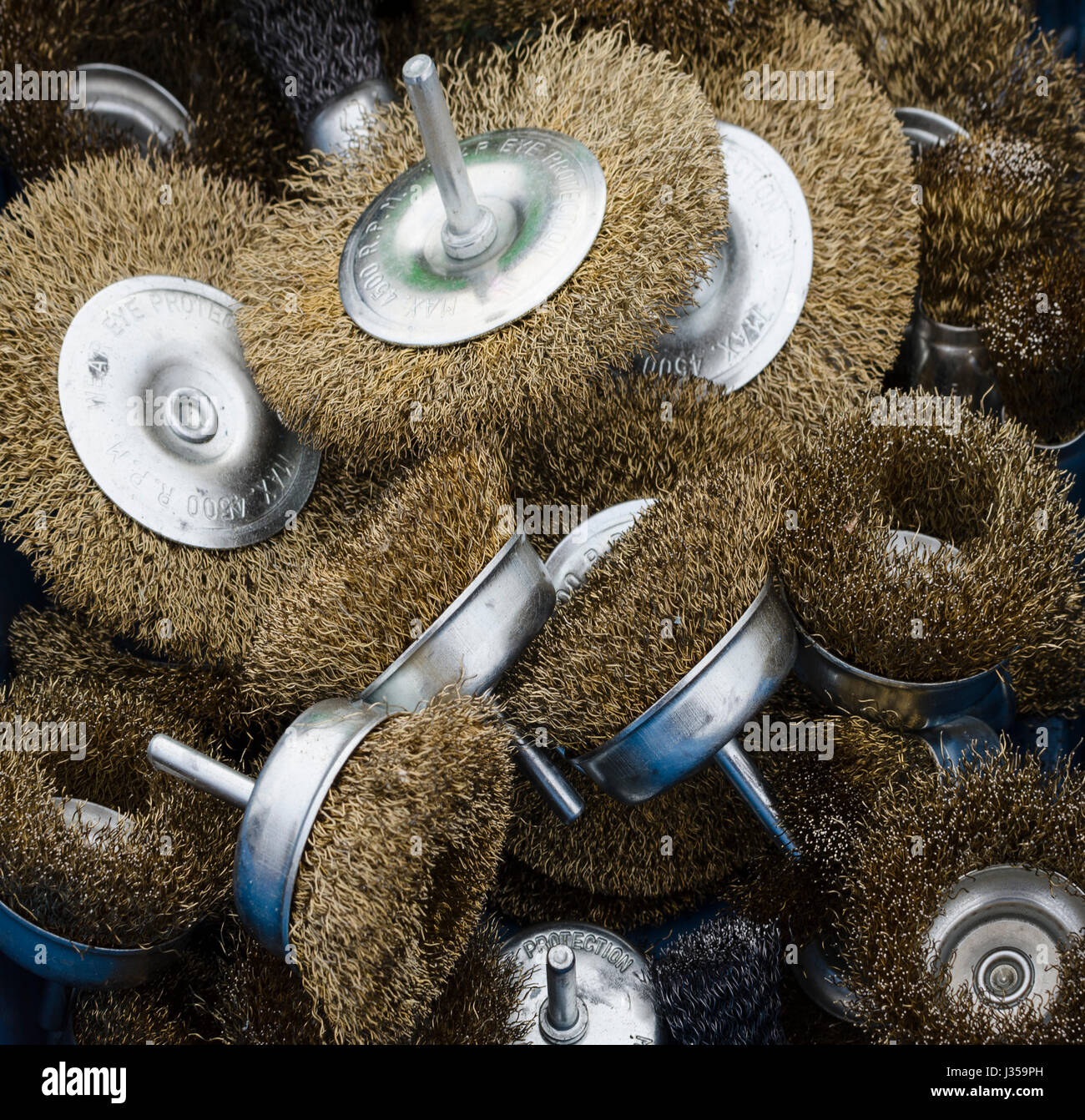 A selection of brass wire brushes for use with a drill Stock Photo Alamy