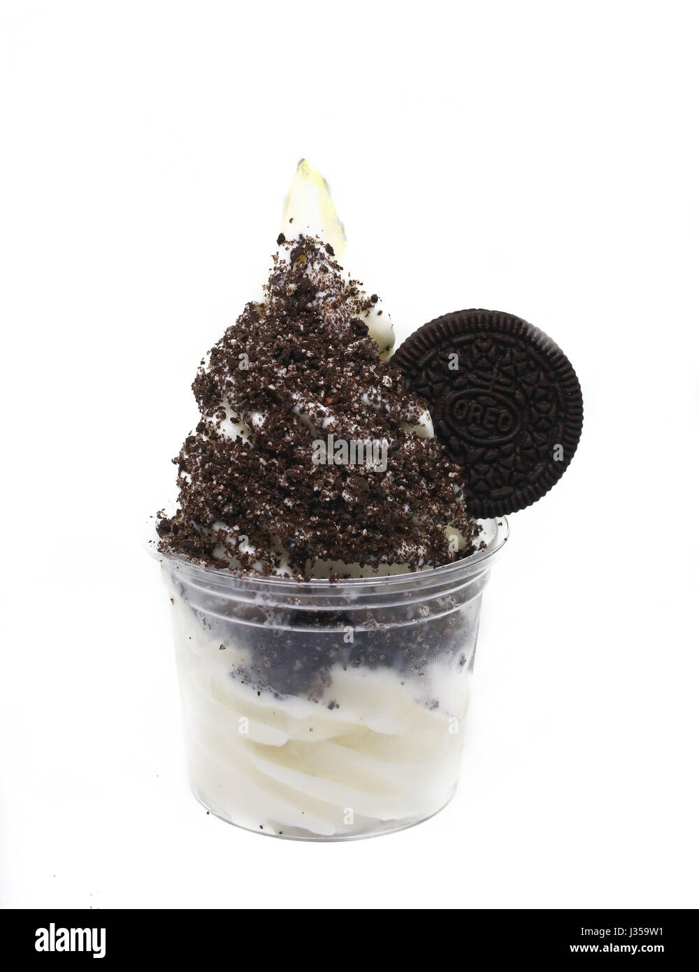 soft serve ice cream in a cup with topping Stock Photo Alamy