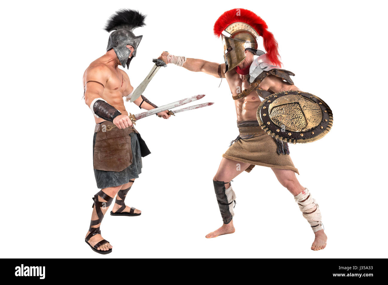 Ancient warriors or Gladiators fighting isolated in white Stock Photo