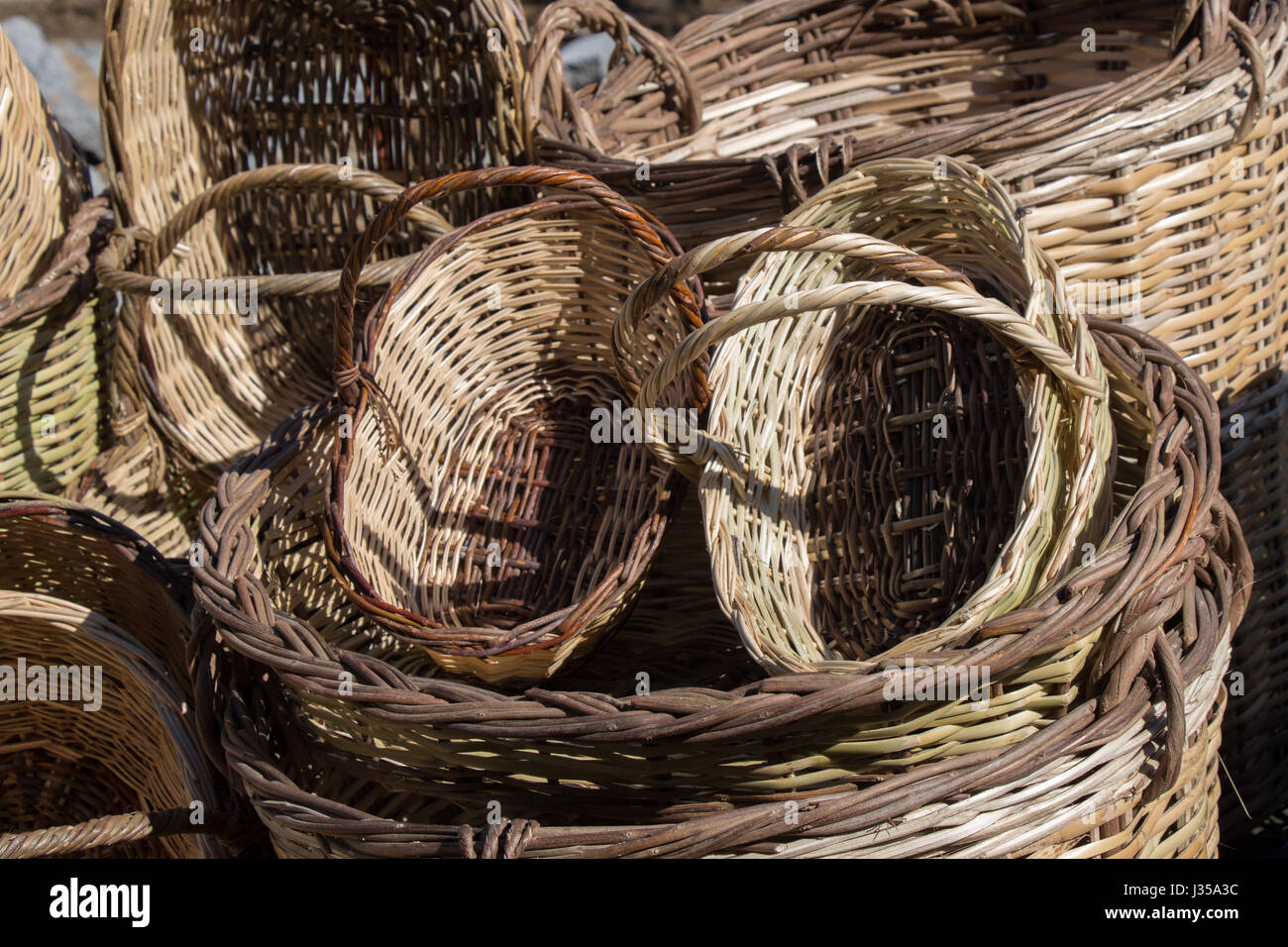 Empty wicker baskets are for sale in a market place Stock Photo - Alamy