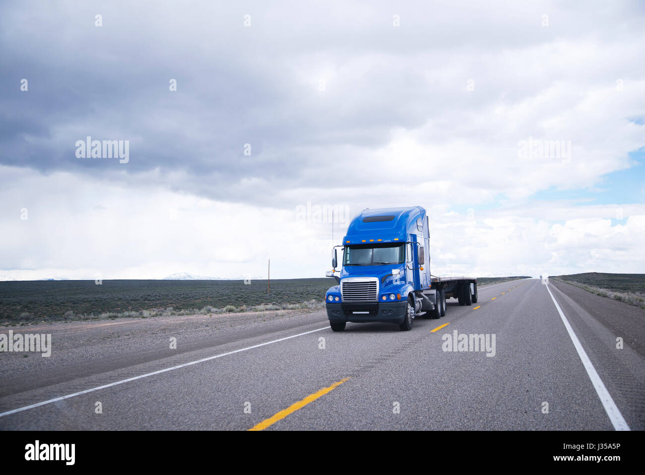 Modern Powerful Big Rig Blue Semi Truck With A High Cabin And A