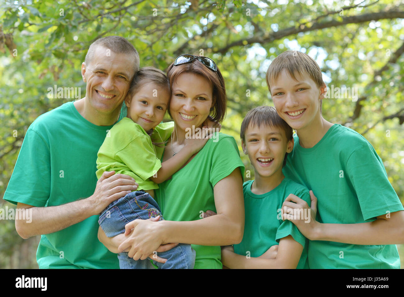 Happy parents with children  outdoors Stock Photo