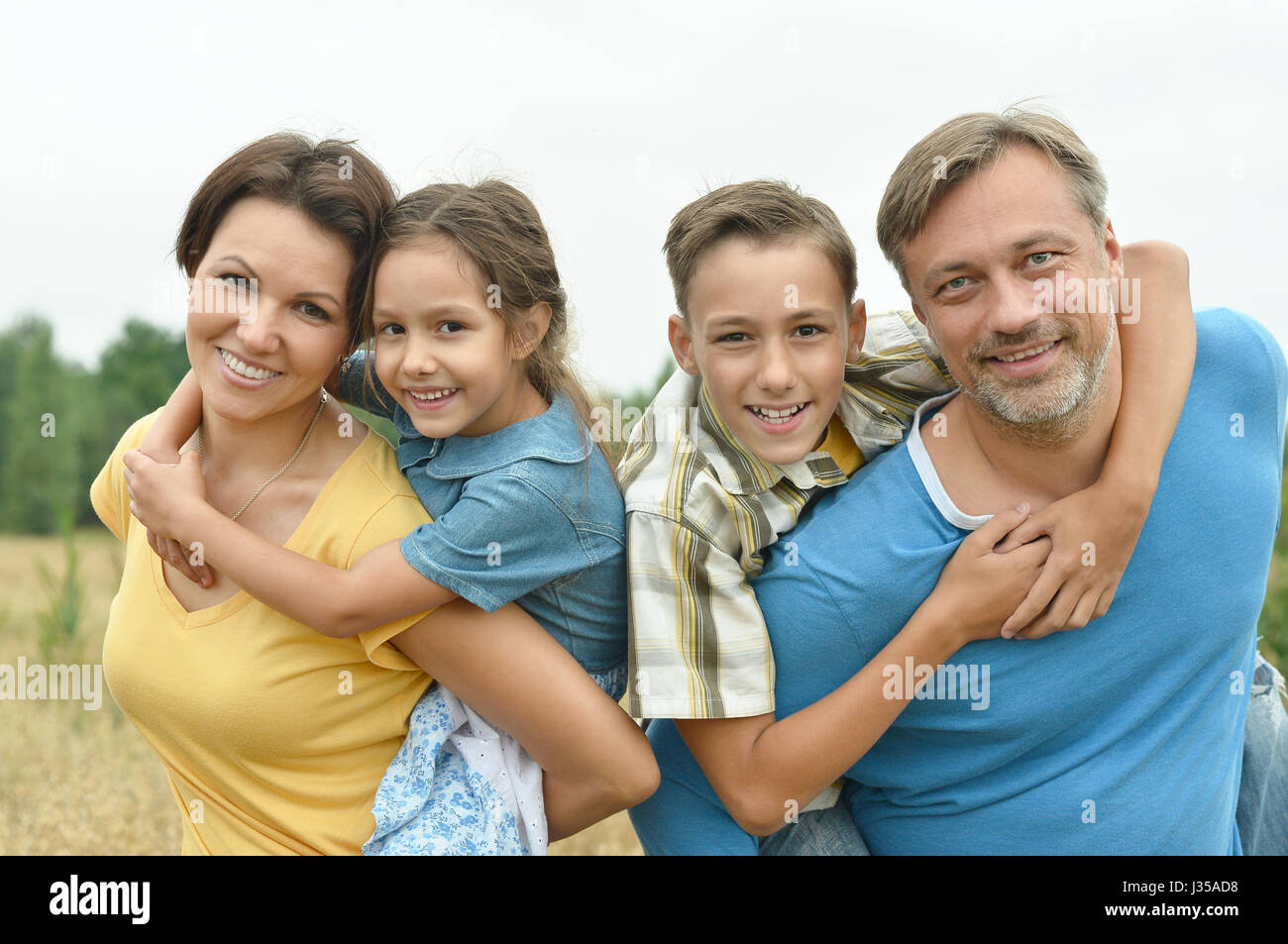 Happy parents with children  outdoors Stock Photo