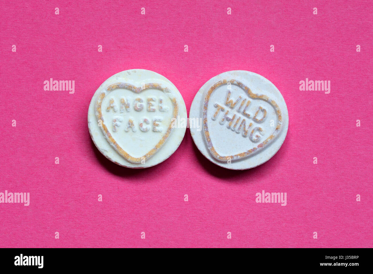 Love Heart Sweets with a conceptual twist. Stock Photo