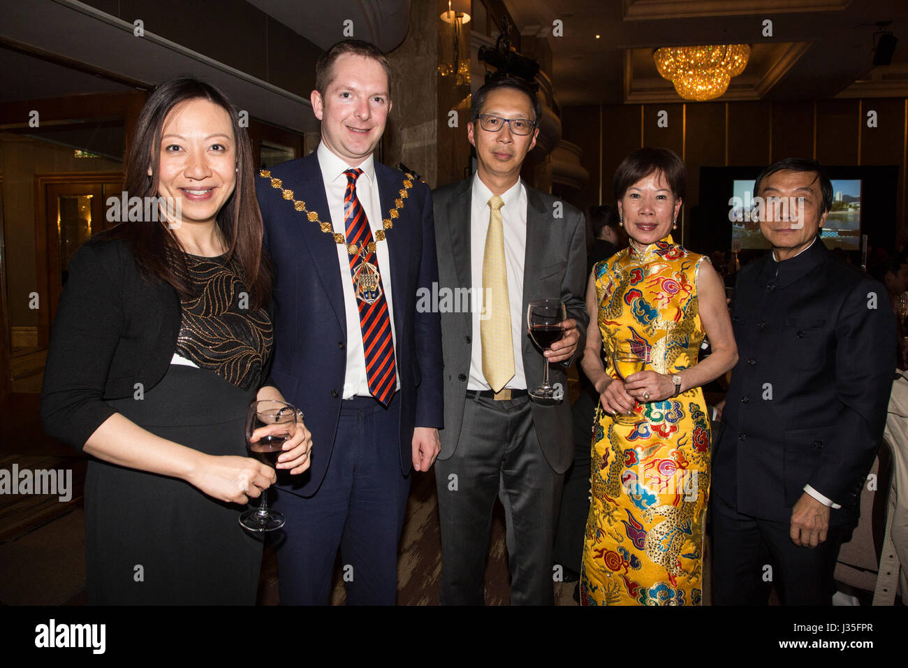 London, UK. 2nd May, 2017. Steve Summers, the Lord Mayor of Westminster (centre) poses with organisers and leaders of the London Chinese community. The Hong Kong Fashion Designers Showcase takes place at the London Hilton featuring clothes by Daniel Poole, Daydream Nation, Injury and Kenaxleung with accessories by Jaycow and ZO-EE. The event was organised by the Hong Kong Executives Club and the Chinese Community Centre. Credit: Vibrant Pictures/Alamy Live News Stock Photo