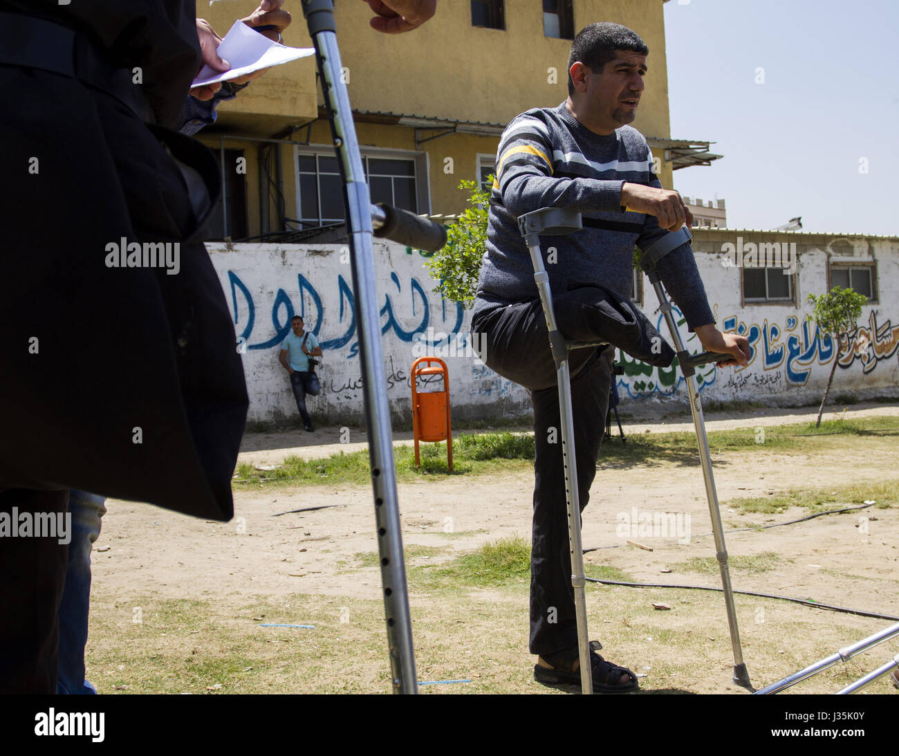 Gaza City, The Gaza Strip, Palestine. 3rd May, 2017. Four young Palestinians who were mutilated during Israeli air strikes with crutches help to enjoy their time at Saraya Park in central Gaza City. Credit: Mahmoud Issa/Quds Net News/ZUMA Wire/Alamy Live News Stock Photo