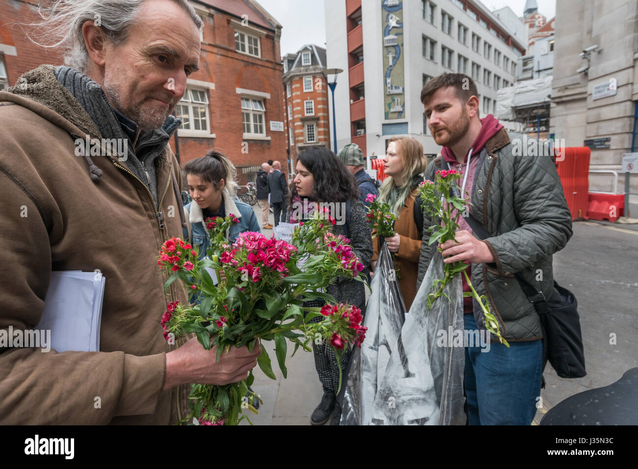 London, UK. 3rd May 2017. Roger Hallam and ohter protesters at the end of the latest protest calling on the LSE to put the equality at the root of its teaching into practice for the low paid workers at the LSE. A man was arrested for so-called 'criminal damage', writing on a wall with wipe-clean chalk spray. He was tackled bodily by a LSE security guard when only writing the third letter of his intended slogan 'END INEQUALITY AT THE LSE'. Credit: Peter Marshall/Alamy Live News Stock Photo