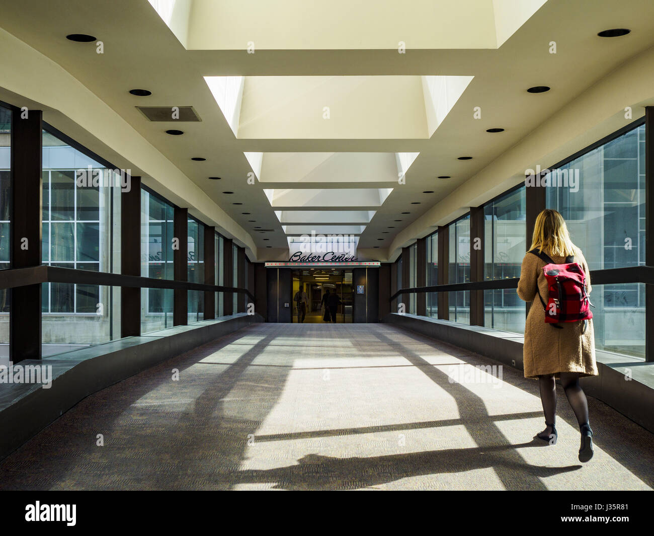 May 3, 2017 - Minneapolis, Minnesota, U.S - The skyway going into Baker Center, a newer building in downtown Minneapolis. The skyways are enclosed pedestrian overpasses that connect downtown buildings. The Minneapolis Skyway was started in the early 1960s as a response to covered shopping malls in the suburbs that were drawing shoppers out of the downtown area. The system grew sporadically until 1974, when the construction of the IDS Center and its center atrium, called the Crystal Court, served as a hub for the downtown skyway system. There are 8 miles of skyways, connecting most of the downt Stock Photo