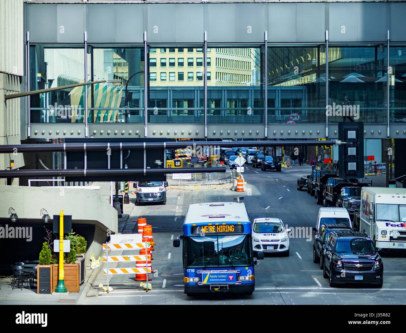 May 3, 2017 - Minneapolis, Minnesota, U.S - The skyway in downtown Minneapolis. The skyways are enclosed pedestrian overpasses that connect downtown buildings. The Minneapolis Skyway was started in the early 1960s as a response to covered shopping malls in the suburbs that were drawing shoppers out of the downtown area. The system grew sporadically until 1974, when the construction of the IDS Center and its center atrium, called the Crystal Court, served as a hub for the downtown skyway system. There are 8 miles of skyways, connecting most of the downtown buildings from Target Field (home of t Stock Photo