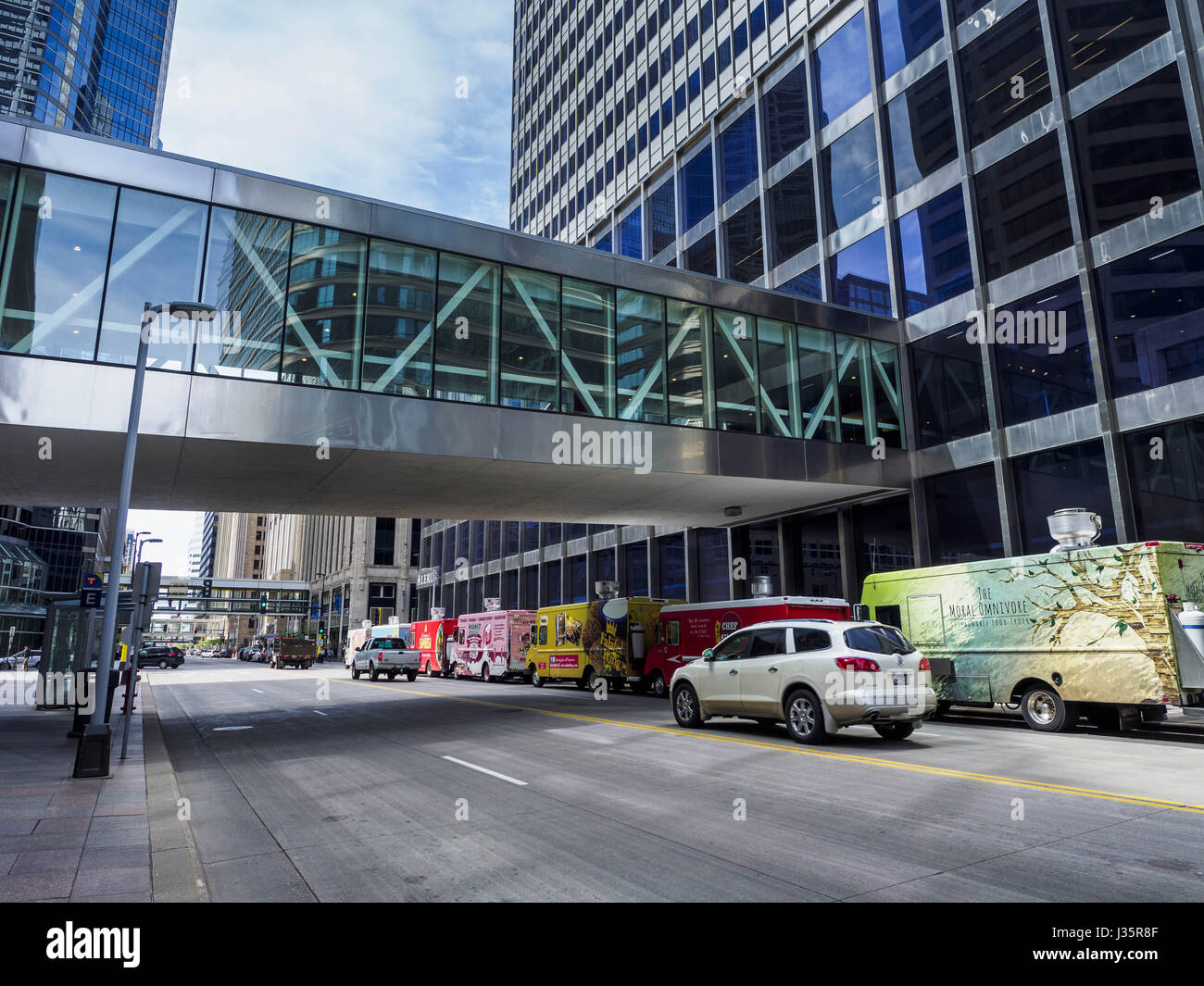 Minneapolis, Minnesota, USA. 3rd May, 2017. Skyways in downtown Minneapolis. The skyways are enclosed pedestrian overpasses that connect downtown buildings. The Minneapolis Skyway was started in the early 1960s as a response to covered shopping malls in the suburbs that were drawing shoppers out of the downtown area. The system grew sporadically until 1974, when the construction of the IDS Center and its center atrium, called the Crystal Court, served as a hub for the downtown skyway system. There are 8 miles of skyways, connecting most of the downtown buildings from Target Field (home of the Stock Photo