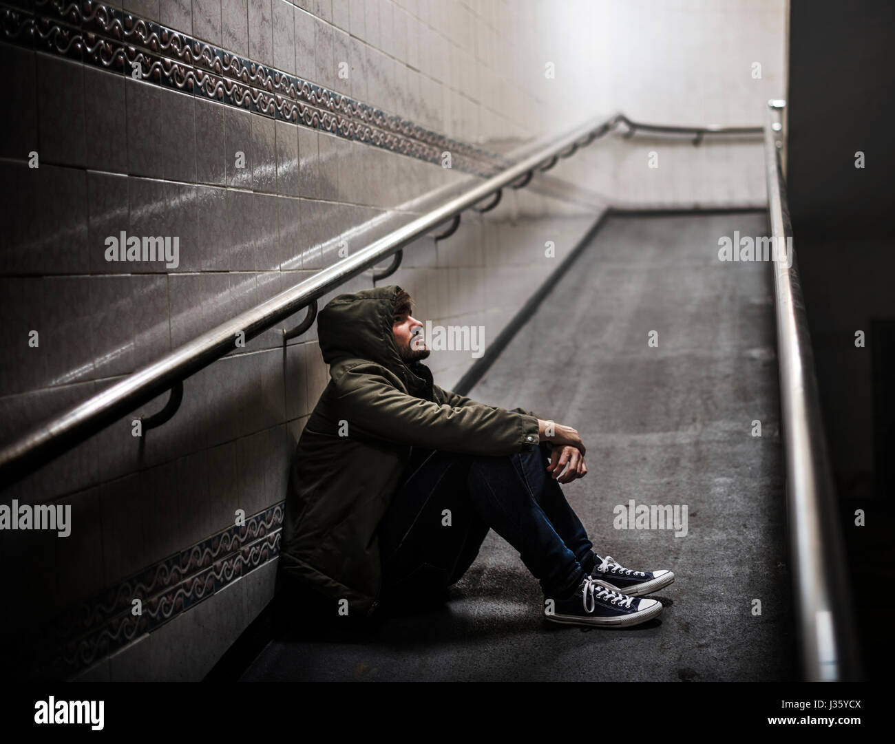 Adult Man Sitting Hopeless on The Floor Stock Photo - Alamy
