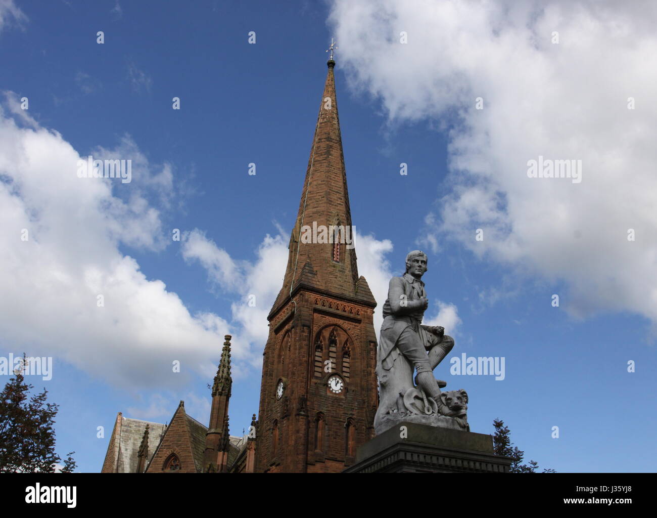 Robbie Burns statue and spire of Greyfriars Kirk Dumfries Scotland