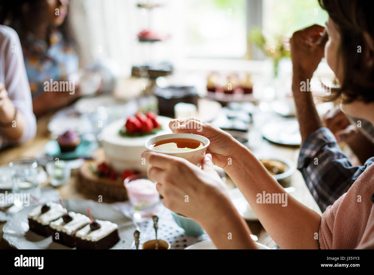 Friends Gathering Together on Tea Party Eating Cakes Enjoyment ...
