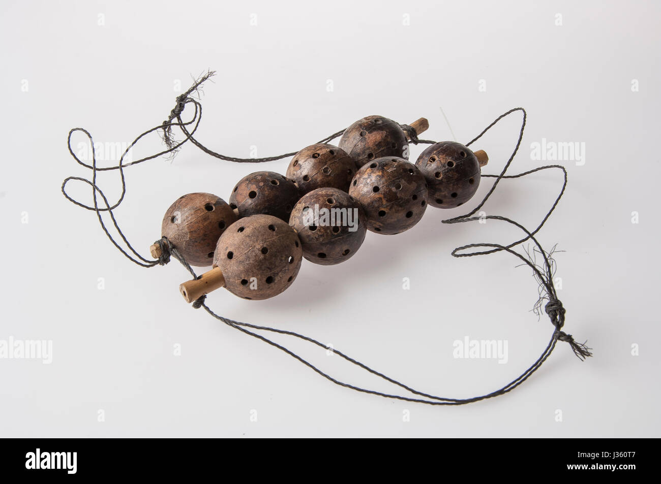 African handmade instrument, rattle isolated on white background Stock