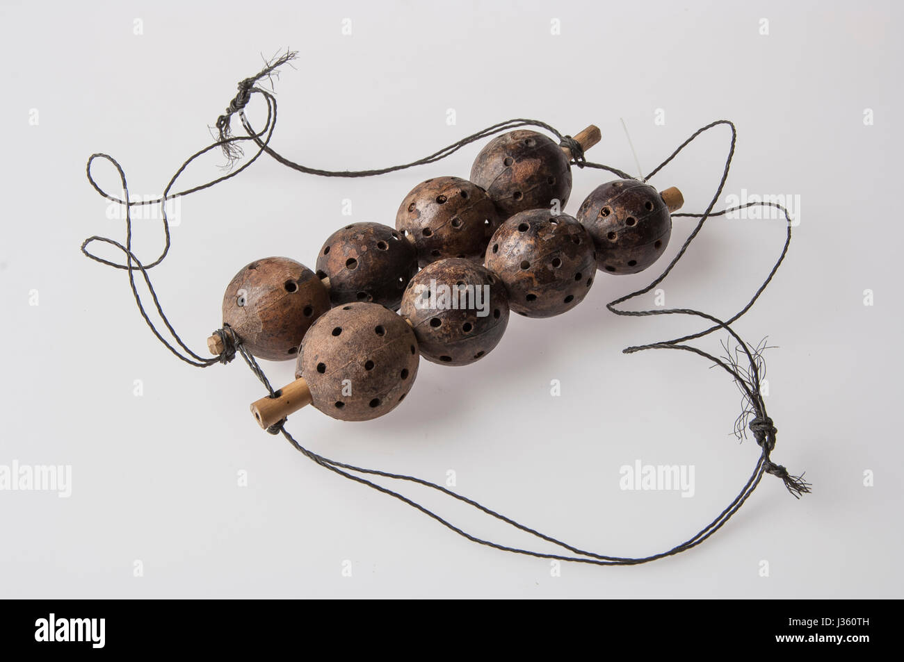 African handmade instrument, rattle isolated on white background Stock