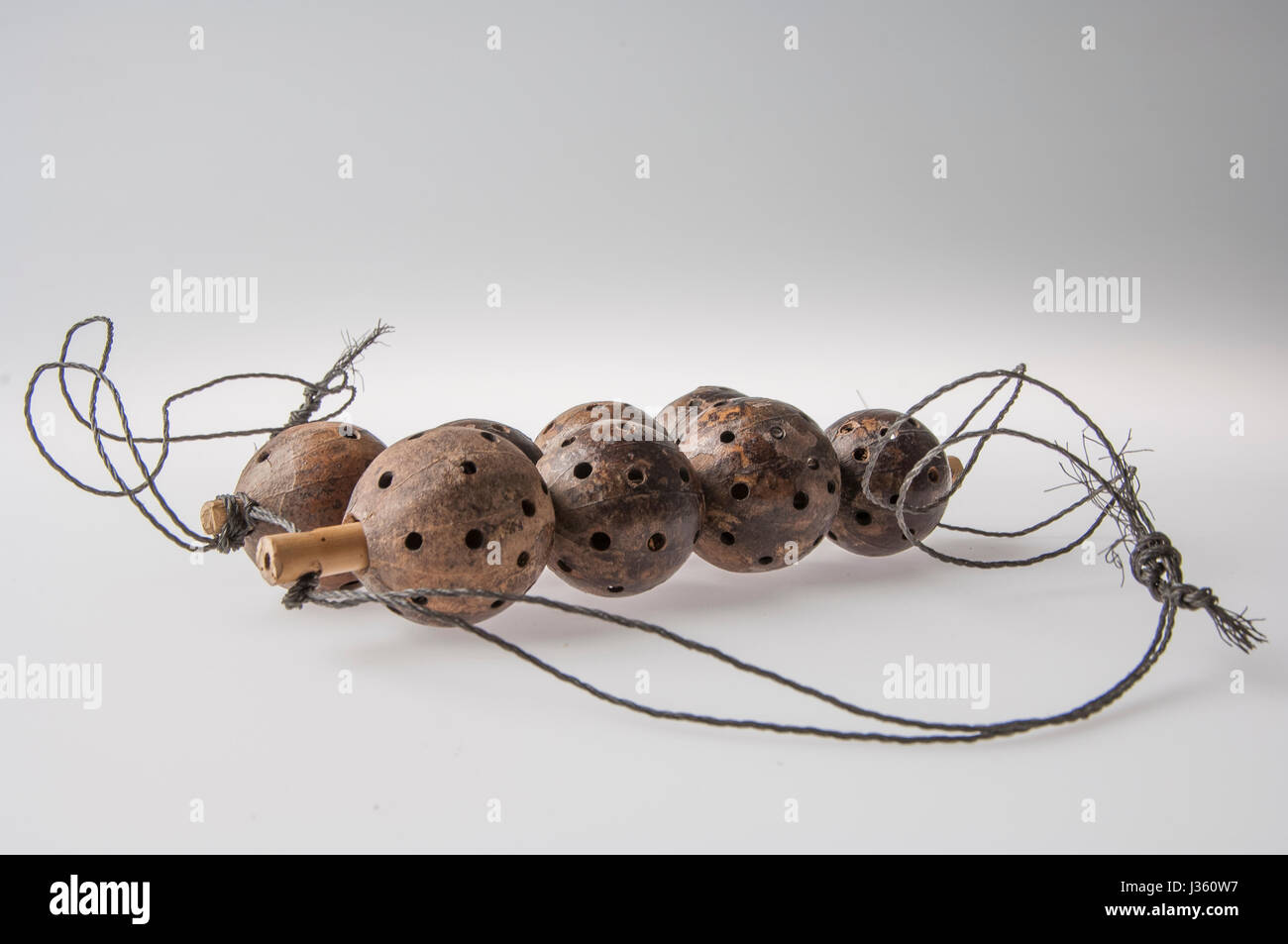 African handmade instrument, rattle isolated on white background Stock