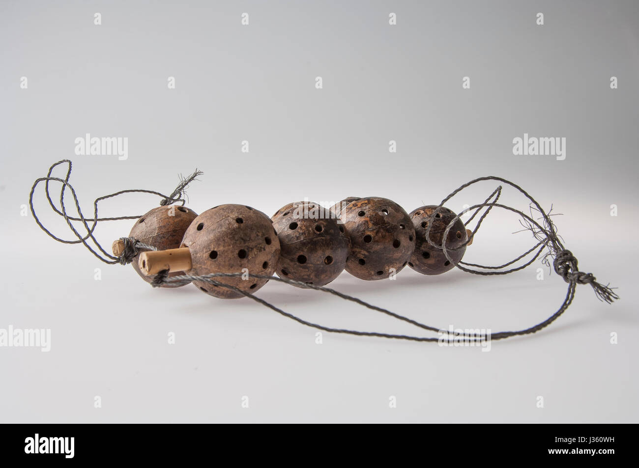 African handmade instrument, rattle isolated on white background Stock Photo Alamy